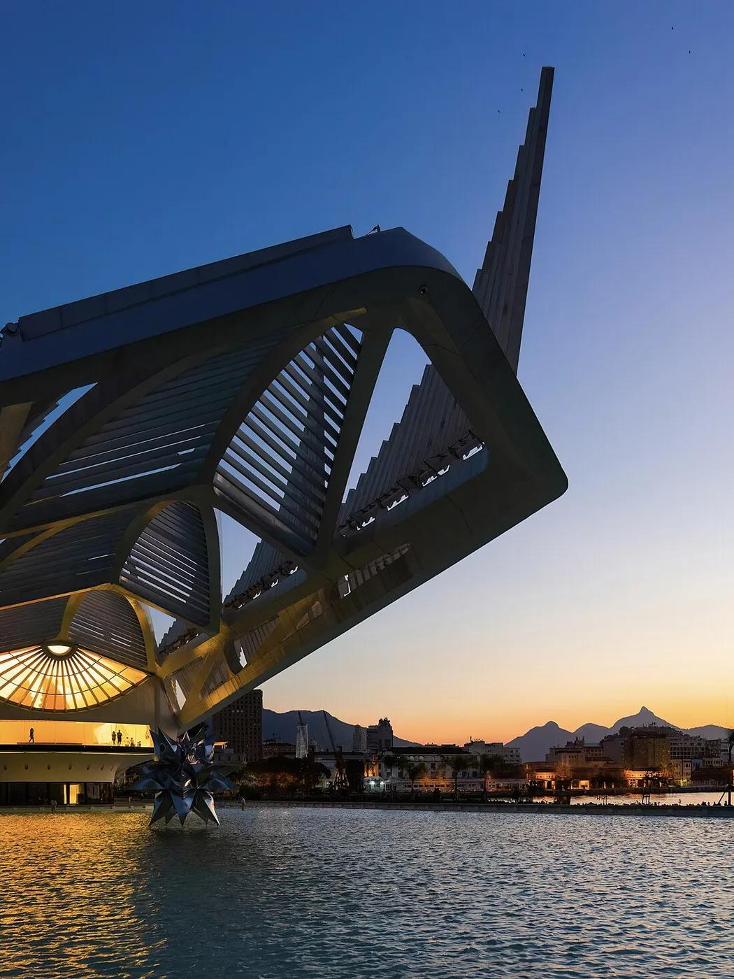 The Museu do Amanhã at dusk, reflected in its pool